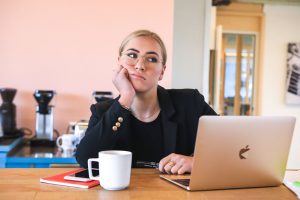 Woman at Laptop looking frustrated